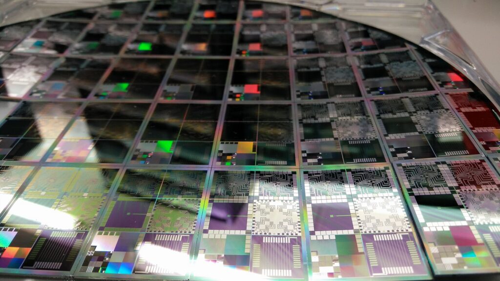 Close-up of a silicon semiconductor wafer with rows of microchips